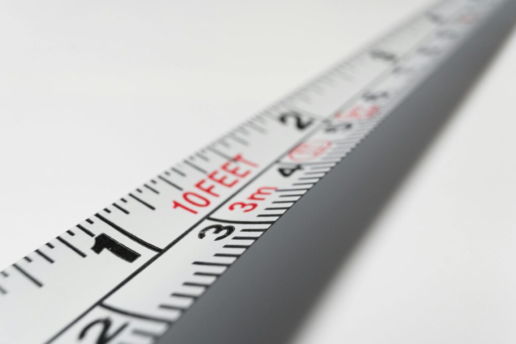 Detailed close-up of a measuring tape indicating measurements in feet and meters.